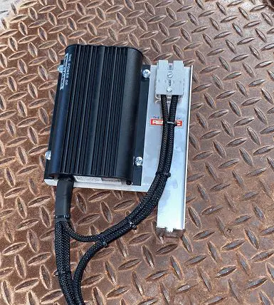 Electrical unit and wiring mounted on a metal plate