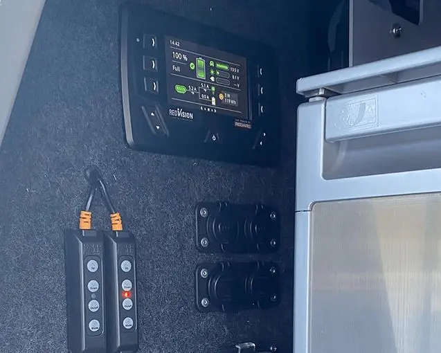 12V control panel and power outlets in a touring vehicle